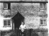 lady-child-outside-chalk-cottage